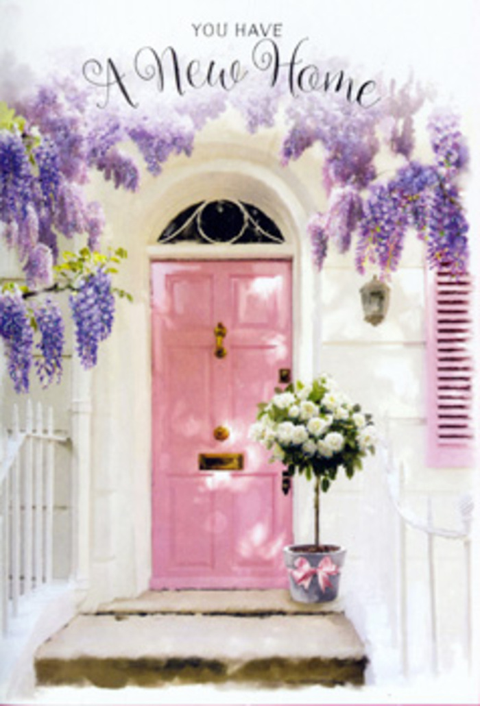 The scene shows a lovingly styled entrance in De Beauvoir Town, as if a florist has gifted a moment of calm to a busy London day. A painted pink door, in a soft, rosy shade that feels both playful and refined, stands at the centre, its panels catching the daylight that filters between the leafy streets off Kingsland Road. The surrounding wall is whitewashed and slightly textured, with a subtle pastel shutter to one side, allowing the light to dance gently across the façade. From above, wisteria cascades in loose, abundant garlands of lavender and lilac blooms, hanging like velvety tassels. Each cluster of flowers adds to the sense of movement, as though the doorway itself is breathing in the delicate scent and exhaling comfort. On the threshold, a grey metal bucket sits solid and reassuring, yet softened by its contents: an overflowing arrangement of creamy white roses and lush green foliage. The roses are tightly packed yet individually defined, their petals like folded satin, giving the impression of freshness and care, as if they have just arrived from an early-morning market near Islington or Broadway Market. Around them, sprigs of tender greenery add depth and a whisper of woodland calm. Tied around the base of the bucket, a blush pink ribbon curves into an elegant bow, mirroring the values of thoughtfulness and welcome. The whole composition feels like an artistic promise that this house will be filled with laughter, shared suppers, and long conversations. It is the kind of floral vignette chosen to congratulate someone on a new home along De Beauvoir's Georgian terraces, offering beauty, reassurance, and a quiet sense of belonging right at their doorstep.
